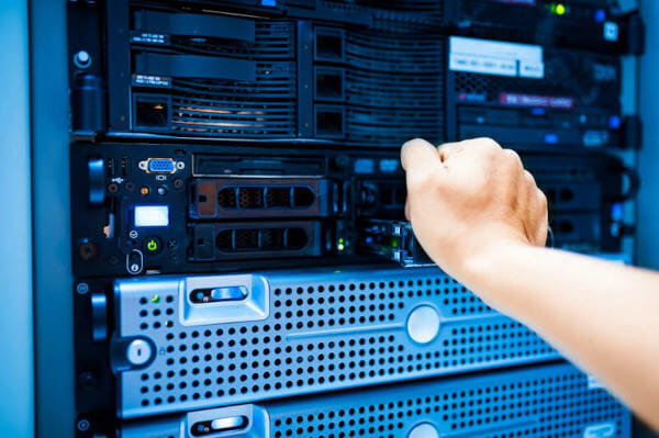 Technician working on server racks